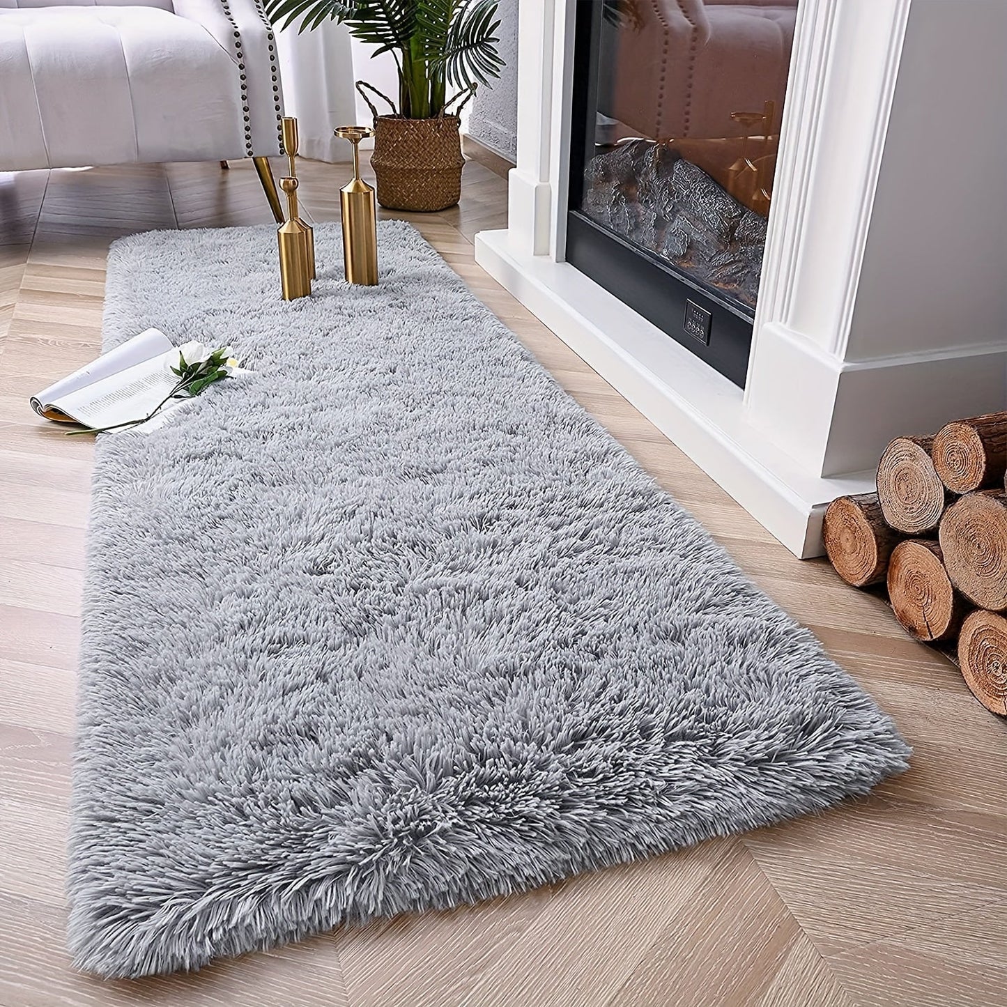 Soft and plush modern shaggy area rug, perfect for adding comfort and style to any indoor space. Made of polyester material, this decorative rug is ideal for living rooms, bedrooms, studies, and lounges. Dry clean only.