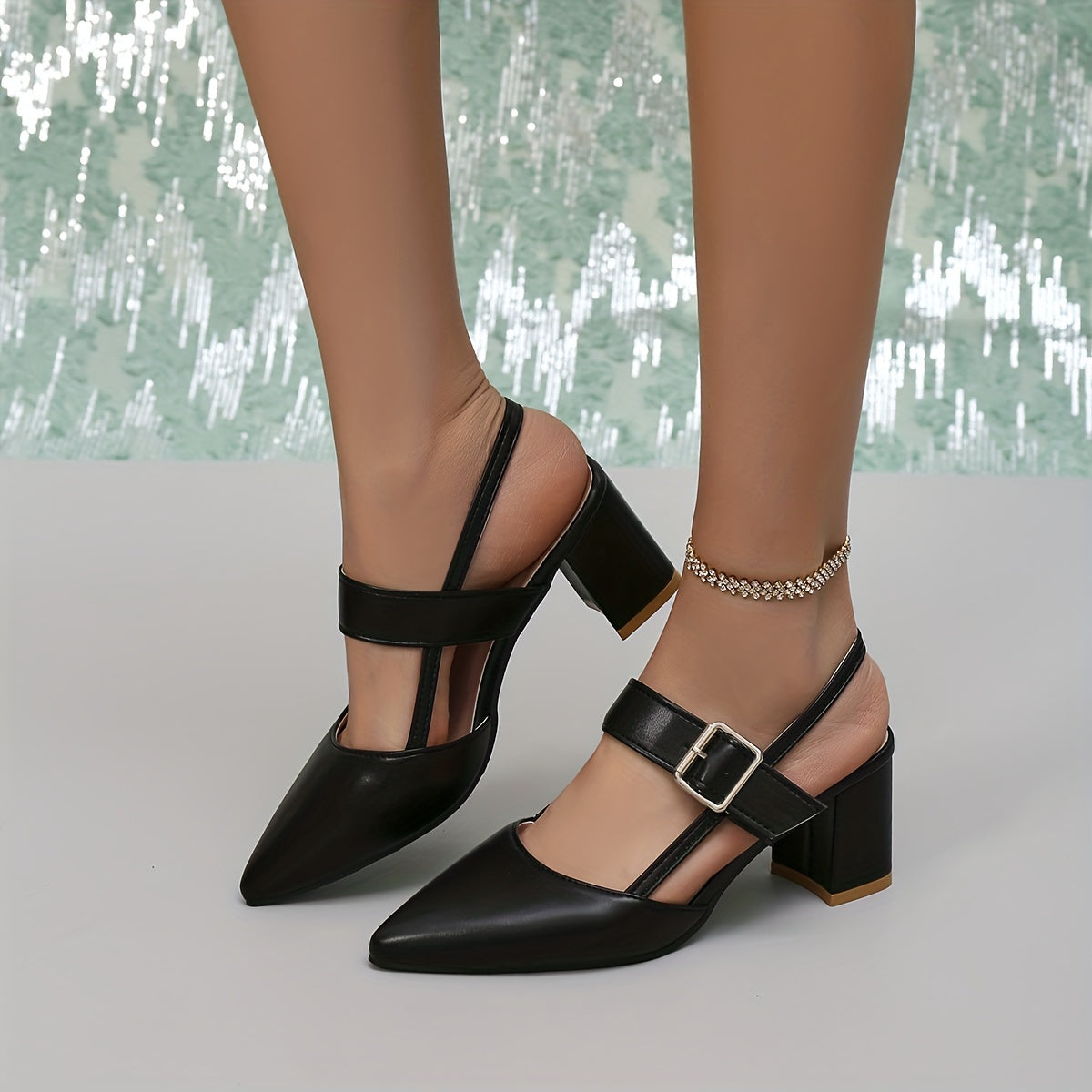 Women's black block heel sandals with pointed toe, slip-on style, and faux sole. Made from man-made materials, suitable for all-season fall footwear.