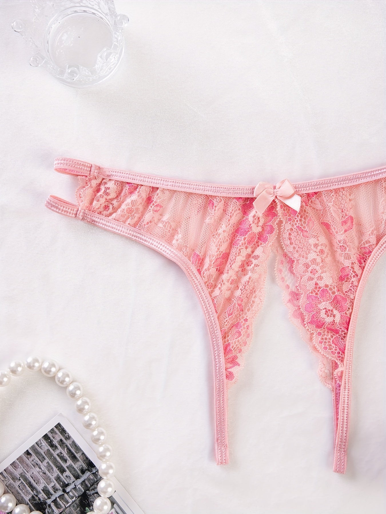 Stylish floral lace panties featuring bow detail, semi-sheer, comfortable fit for plus size women. Cute and fashionable.