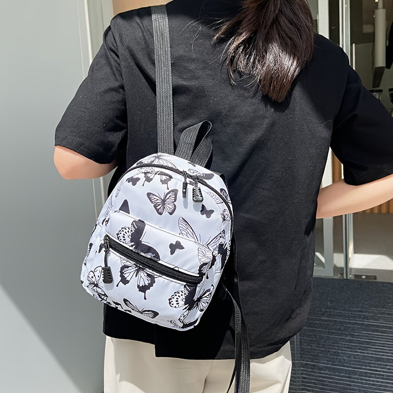 Playful butterfly-printed backpack for girls in preppy style with adjustable strap, white polyester lining. Hand wash or dry clean.