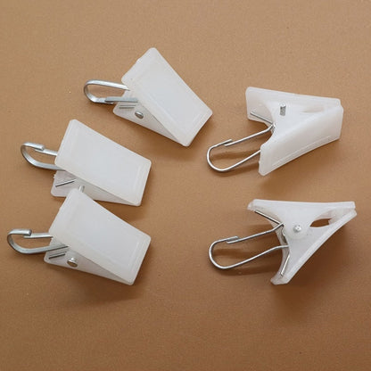 This 20-piece set of white plastic clothespins is ideal for hanging curtains, bathrobes, and other items. Please note that these clothespins should be hand washed only.