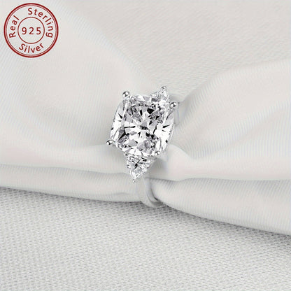 This stunning engagement ring features an elegant design with sparkling 3-stone synthetic cubic zirconia in square and triangle shapes. Made from 925 sterling silver with a high-polished finish, this ring is perfect for weddings and anniversaries. It