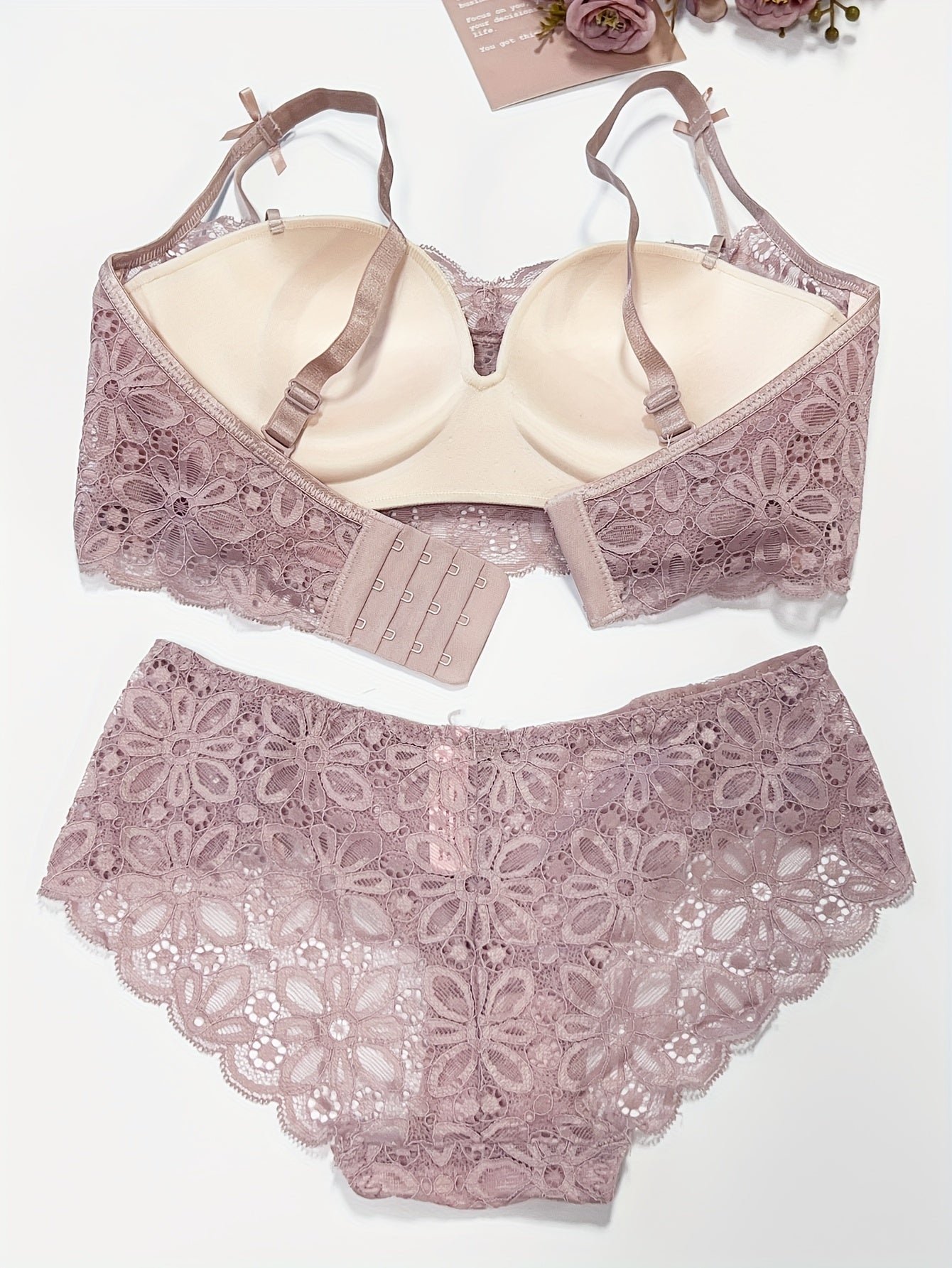 Sexy lace lingerie set for women, with medium support bra and drop waist briefs. Made of polyamide and elastane blend with knit fabric weave. Features solid color with contrast lace details