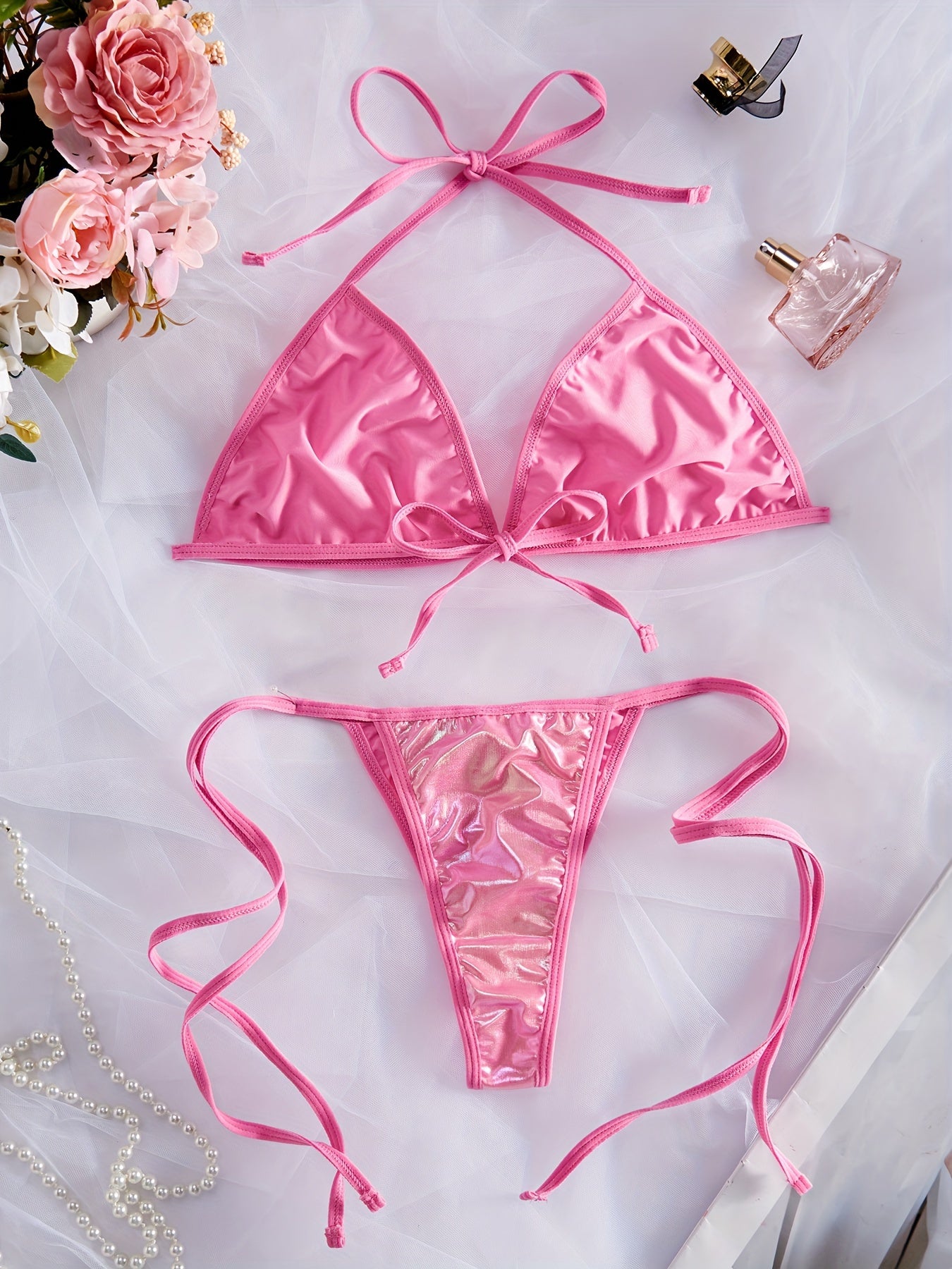 Metallic halter neck lingerie set with backless bra and tie side thong for women.