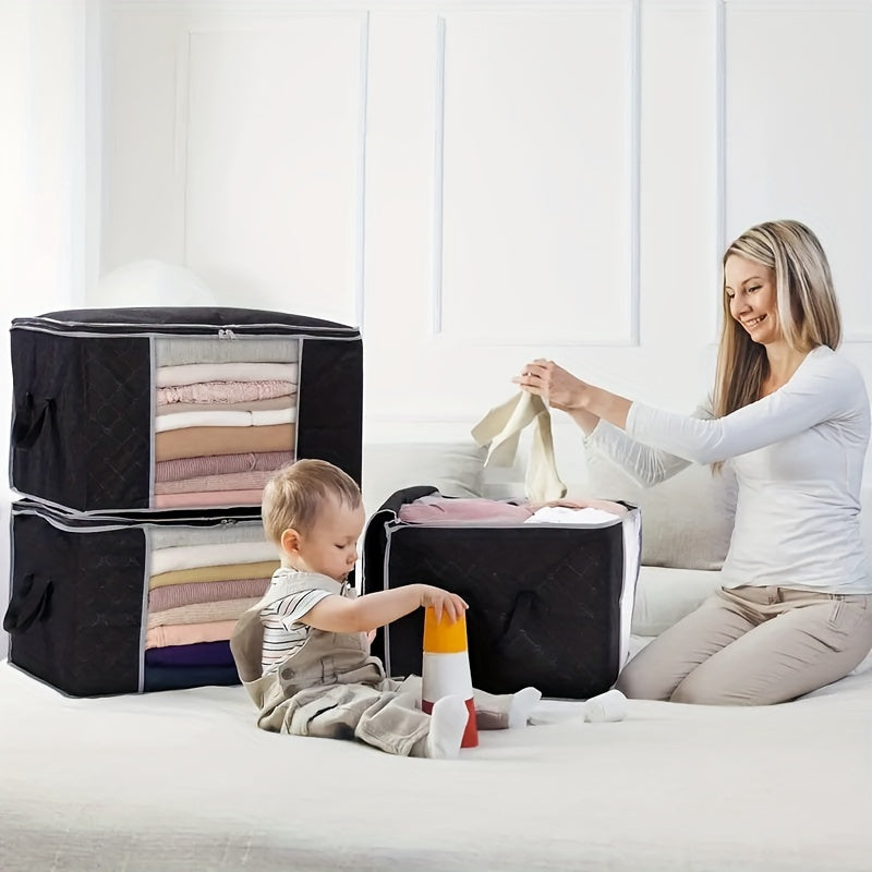 Three 90L storage bags with reinforced handles for organizing clothing, blankets, toys, and bedding in a bedroom wardrobe.