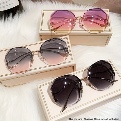 Luxury frameless round glasses for women with stylish gradient lenses and metallic finish.