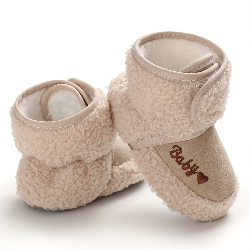 Cozy boots for baby boys and girls, featuring hook and loop fasteners for indoor and outdoor winter walks.