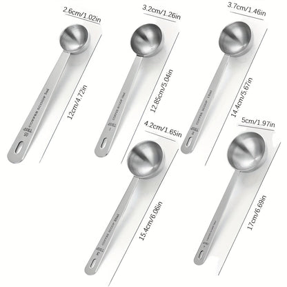 Set of long-handled stainless steel coffee scoops with multiple measurement options, suitable for ground coffee, tea, and powders. Ideal for travel, camping, and gifting, as well as for measuring loose tea. Includes 5ml, 10ml, 15ml, 20ml, and 30ml scoops.