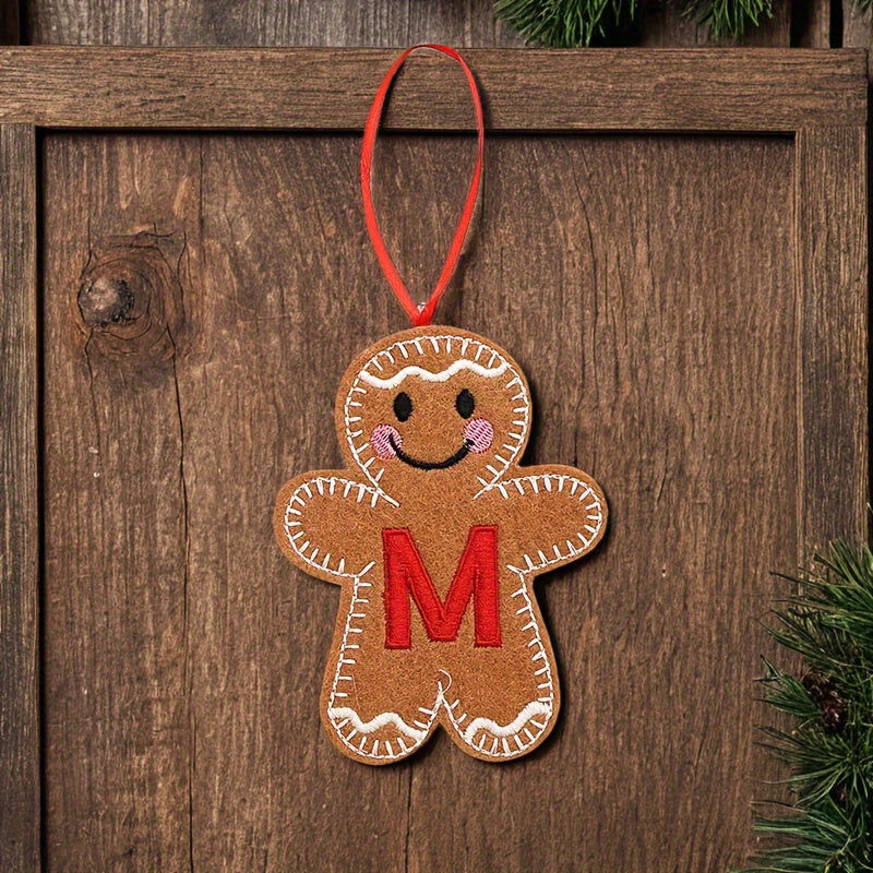 Embroidered gingerbread man ornament for Christmas decoration, made of fabric material. Classic style and no power required. Perfect for home and kitchen use.