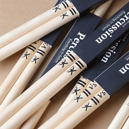 Premium maple drumsticks in 5A and 7A sizes with black logo, suitable for electric drums and practice.