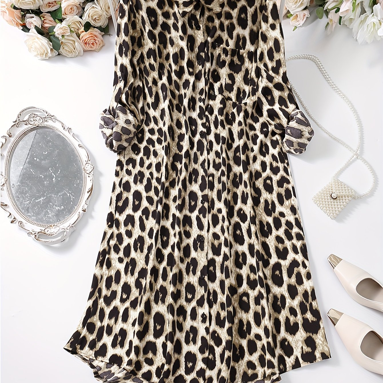 Leopard print button-up shirt dress with rolled sleeves, ideal for spring and autumn.