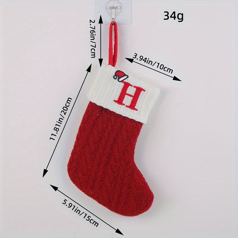 Knitted letter Christmas socks for home tree ornaments; red socks in gift bag for festive attire.