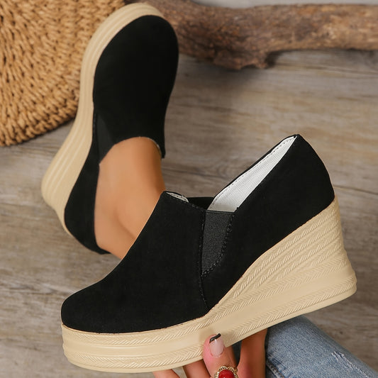 Women's platform wedge sneakers with high heels and slip-on design, featuring faux sole and fabric insole for all-season comfort.