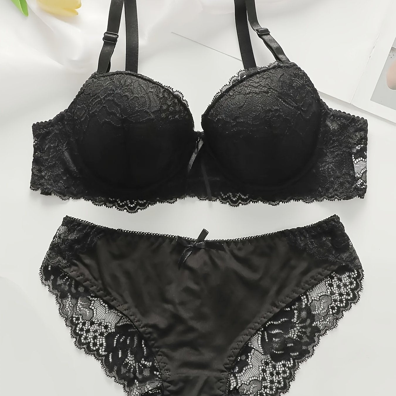 Floral lace lingerie set includes push up bra with adjustable straps and matching see-through briefs.