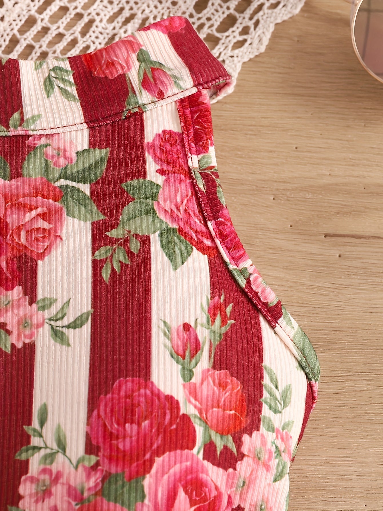 Girls' outfit with red rose print, halter neck stripe top, belt shorts set for summer holidays and outdoor activities.