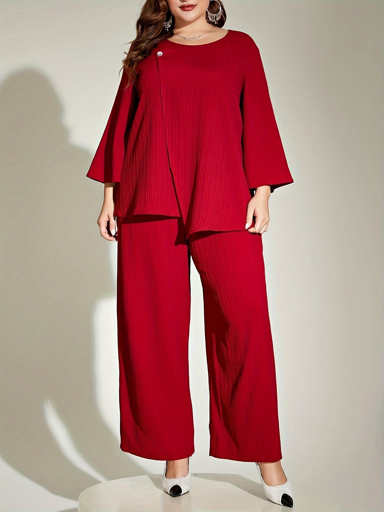 Chic red ribbed suit set for elegant plus size women, includes 3/4 sleeve top and wide-leg pants. Made of polyester, machine washable.