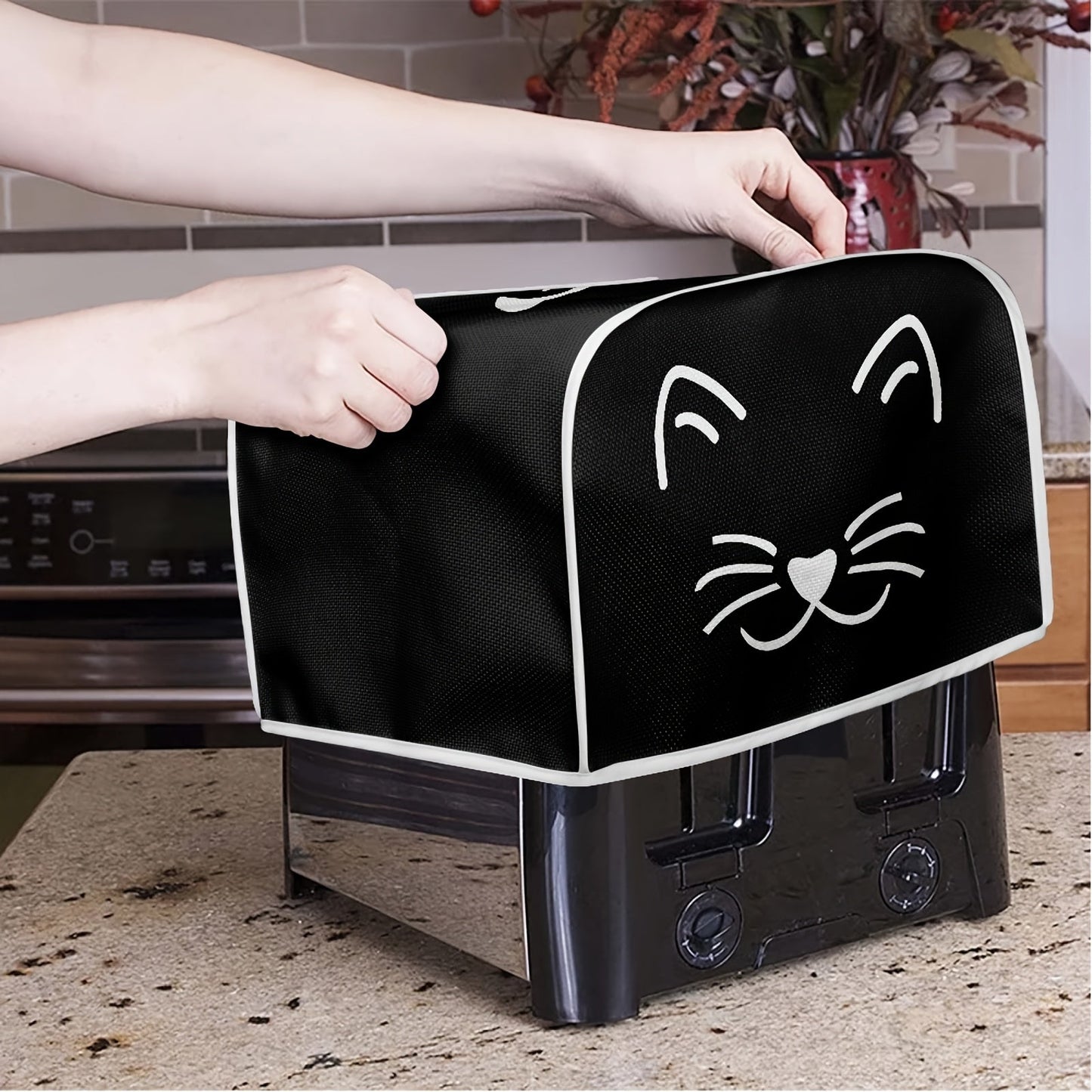 Give the gift of quality with this classic cat print toaster cover. It features 2 wide slots and is dustproof, anti-fingerprint, and anti-oil. This universal kitchen appliance cover is machine washable and perfect for protecting your small appliances and