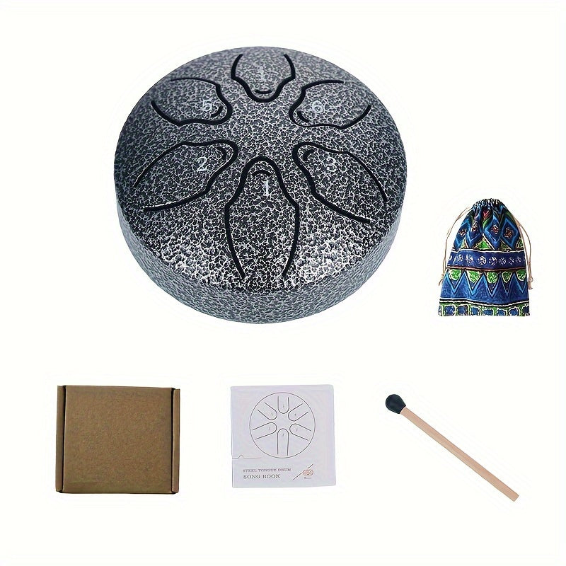 Mini steel tongue drum set with 6 notes, mallets, music book, case, and accessories.