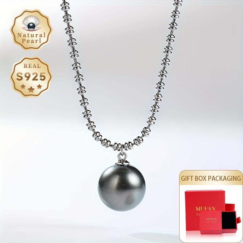 Elegant Vintage-Inspired Black Pearl Pendant Necklace for Women - Featuring Large 10-11mm Round Sea Pearls on an S925 Silver Chain. Perfect June Birthstone Gift presented in a Luxury Red Gift Box. Inspired by Polynesian design, showcasing the Natural