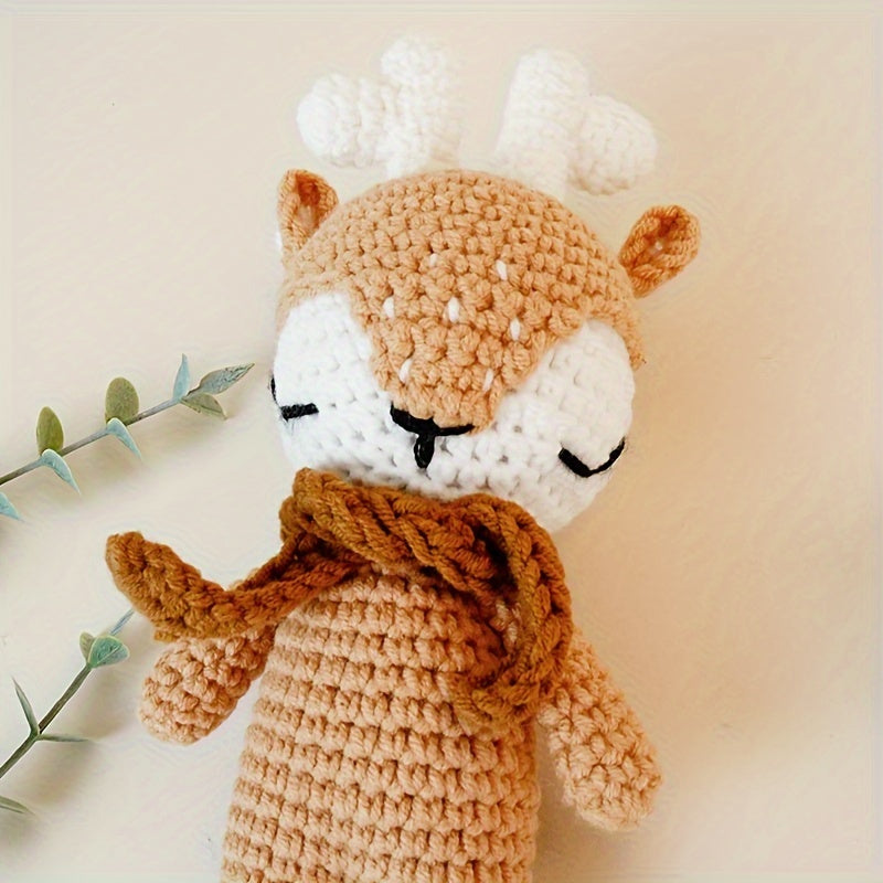 The perfect first Christmas gift for newborns: a handmade crochet baby animal Christmas reindeer doll. Perfect for little ones to snuggle with during the holiday season.