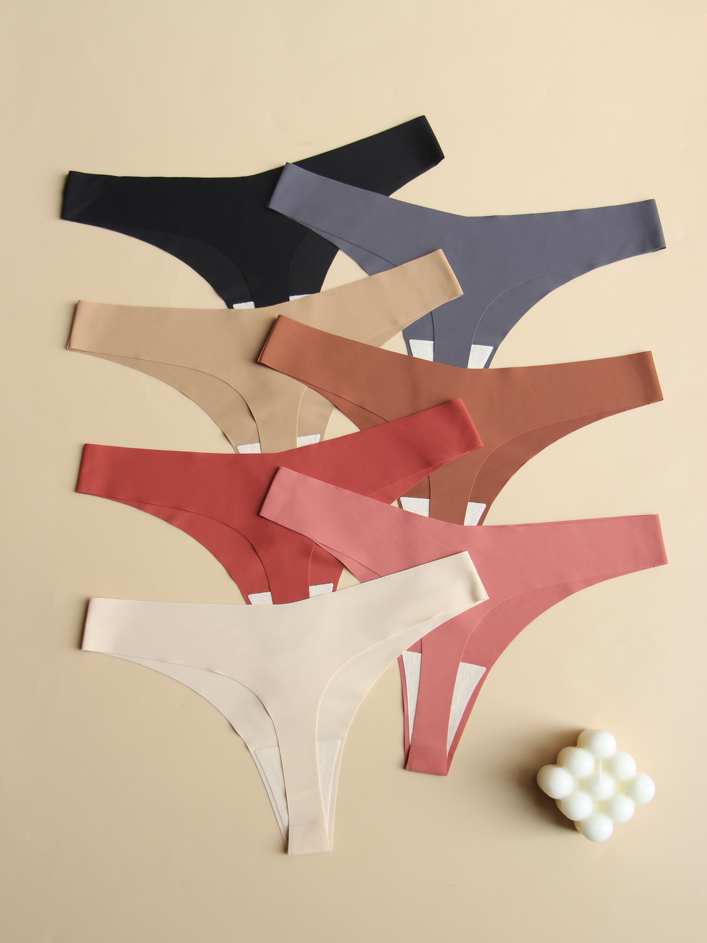 Innovative, comfortable 7-piece plain v-style women's underwear set with breathable, soft fabric and no visible marks.