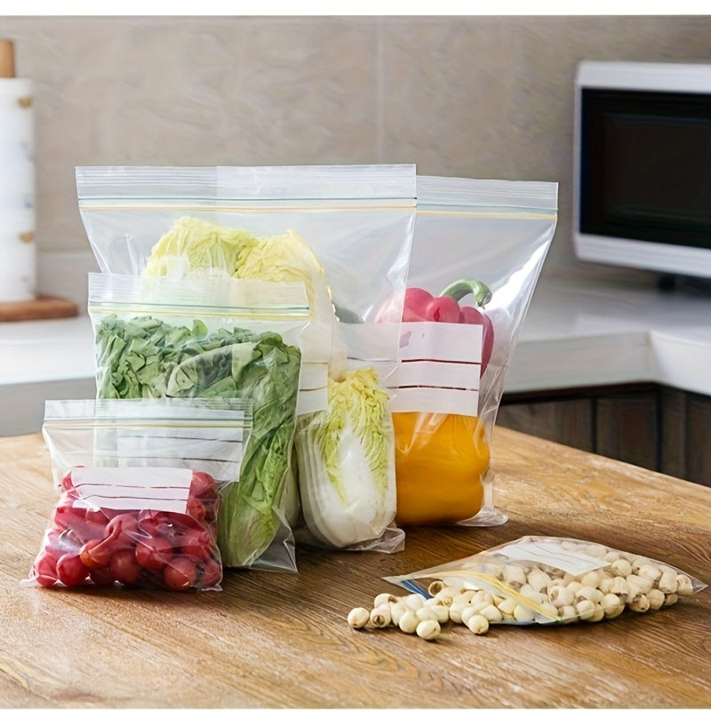 Reusable double-layer seal bags in a pack of 30, made of thick, food-grade plastic to keep your food fresh and suitable for freezing. Ideal for storing fruits, vegetables, and meats in the kitchen, these transparent bags are essential for sealing and