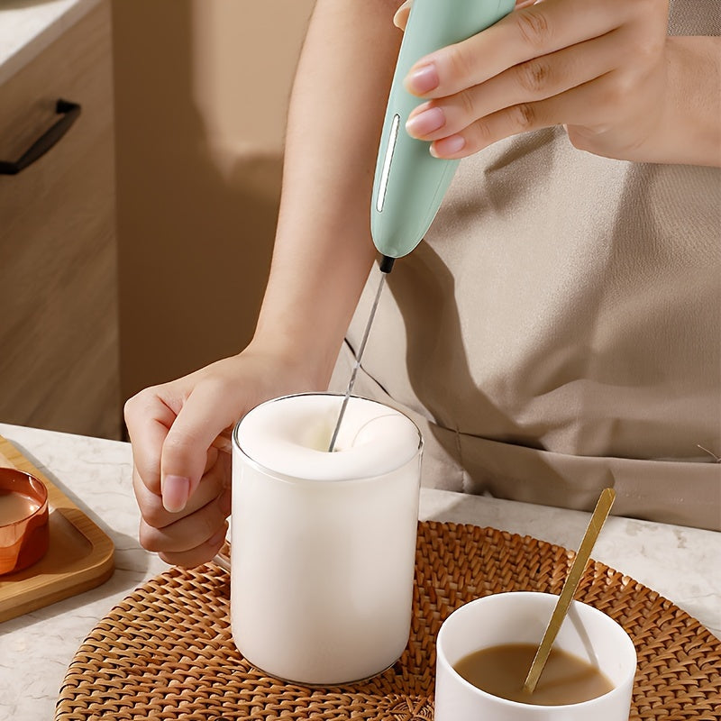 Battery operated handheld milk frother for creating creamy foam in drinks, perfect for coffee and cappuccinos.