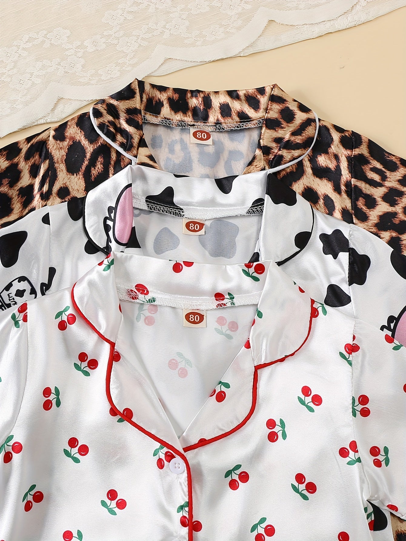 3-piece girl's ice silk clothing set features cute cow, rabbit, and leopard print. Comfortable and skin-friendly for daily wear.