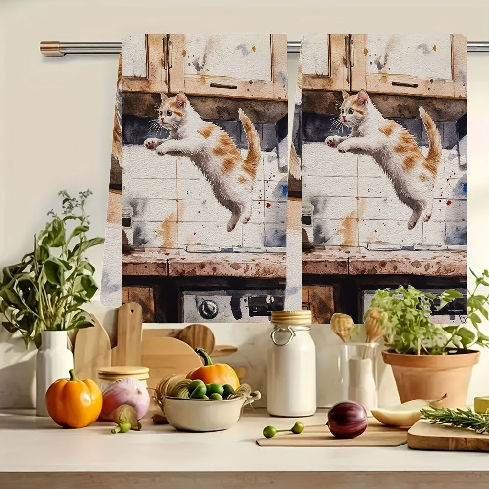 Two pieces of incredibly soft kitchen towels featuring a playful kitten leaping design. These highly absorbent and machine washable dish hand towels are perfect for your contemporary style kitchen. Each towel measures 40.64x60.96 cm and is ideal for