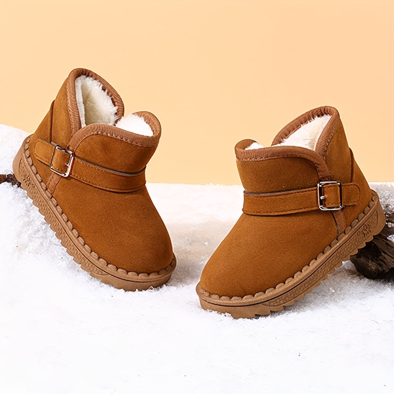 Children's winter boots with cozy fleece lining, warm and breathable, slip-on style with metal buckle straps, available in black and brown for boys and girls.