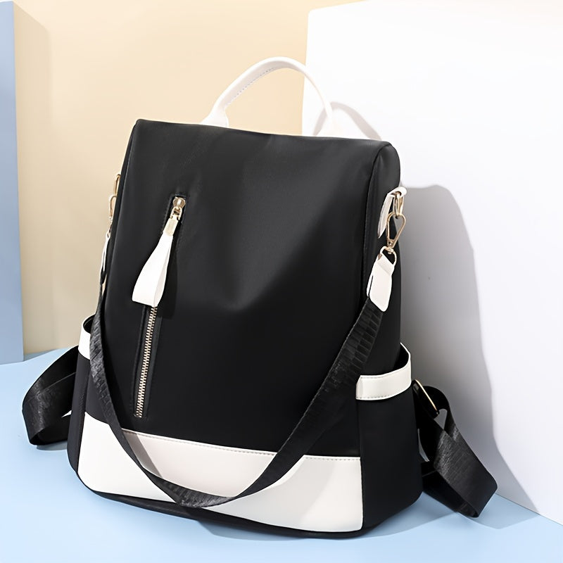 Stylish anti-theft backpack for women, made of lightweight, durable nylon with laptop compartment. Comes in pink, blue, and black.