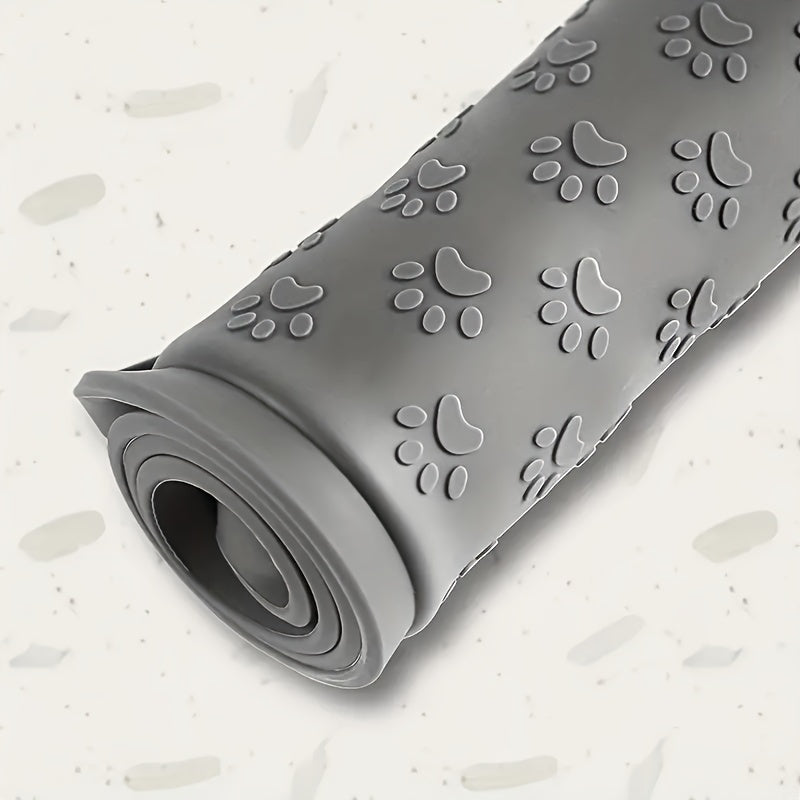 Gray pet feeding mat with paw print design, prevents spills and mess, ideal for cats and dogs.