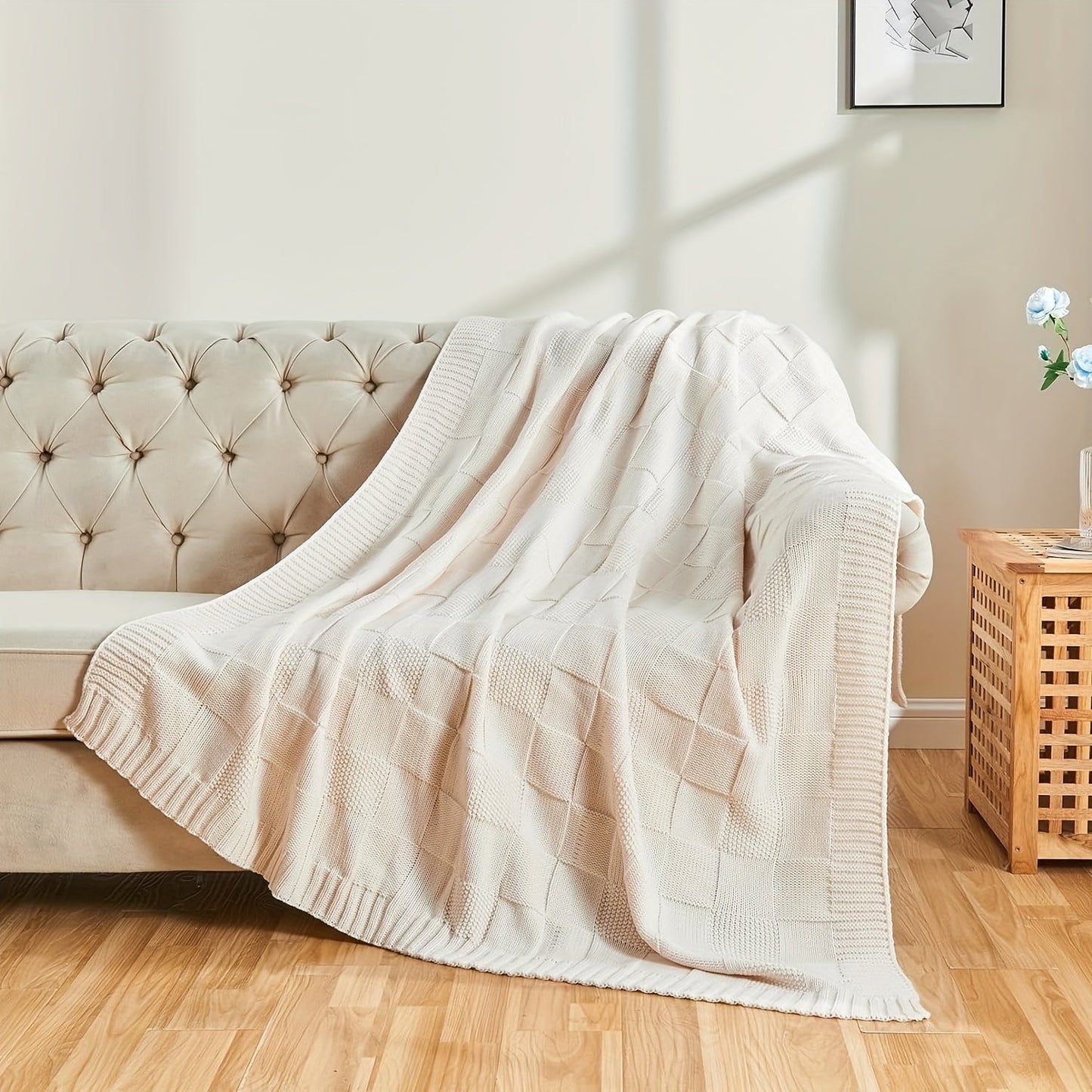 Soft and cozy knit throw blanket in white checkered pattern, perfect for couch or bed. Keep warm and stylish in any room with this knitted throw blanket.