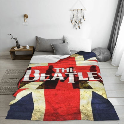 Stay warm and cozy with the ultra-soft Beatles Union Jack fleece throw blanket. Perfect for all seasons, this polyester blanket makes an ideal birthday or Christmas gift. With a contemporary style and knitted flannel in red, white, and blue, this blanket