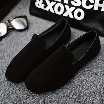 Men's black slip-on loafers with round toe and PVC sole for fashionably casual everyday wear in Spring/Summer 2024.