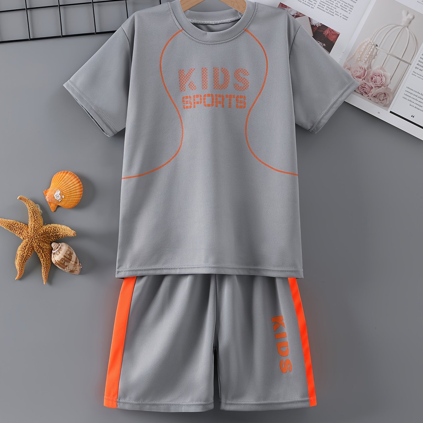 Children's quick-drying sports suit with short-sleeved shorts and KIDS SPORTS printed t-shirt, made with lightweight and comfortable quick-drying fabric.