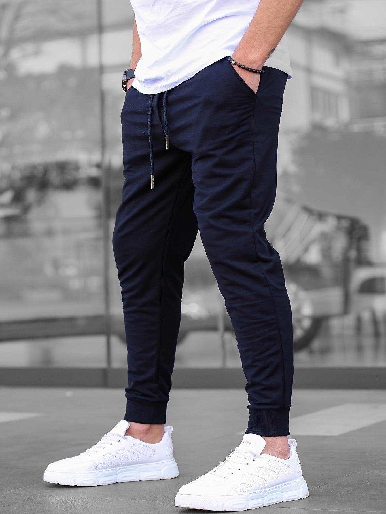 Solid color jogger pants for men with drawstrings, lightweight and breathable for running and fitness.