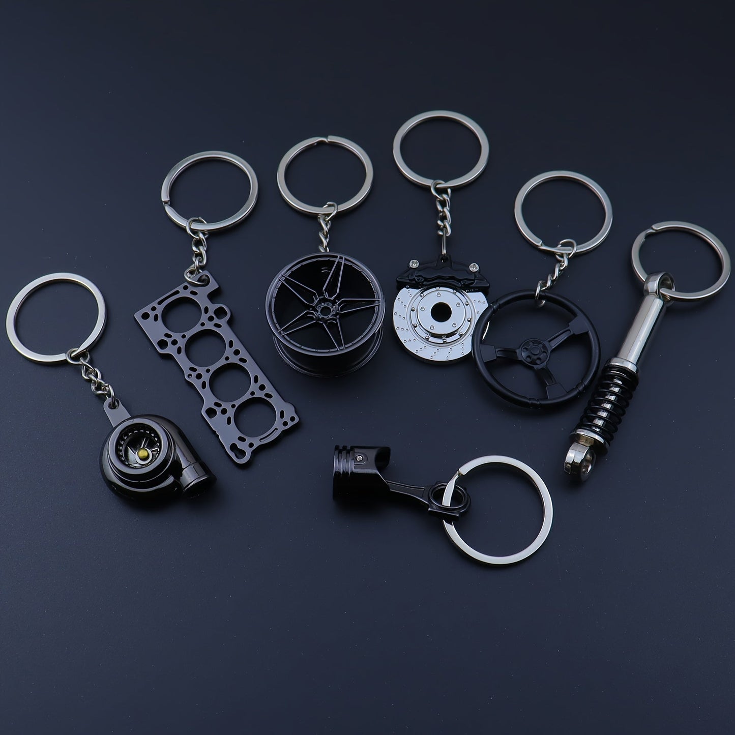 Set of 7 Car Enthusiast Keychains - Sleek Black Zinc Alloy, featuring Engine Block, Turbo, Wheel Hubs, and More - Ideal Gift for Guys