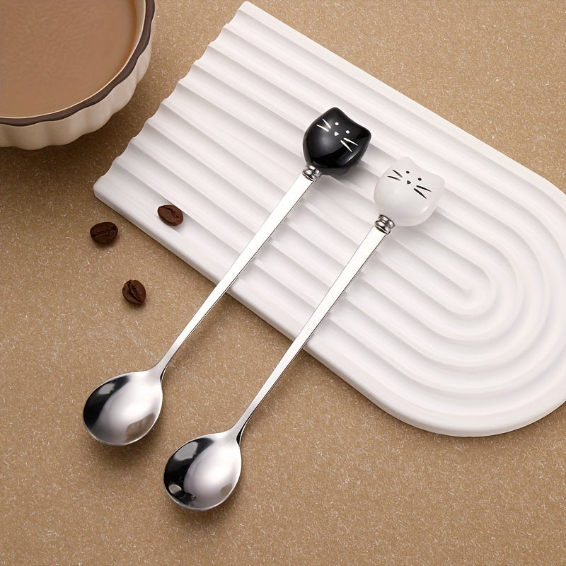 Charming stainless steel coffee stirrers with whimsical ceramic kitty spoons.