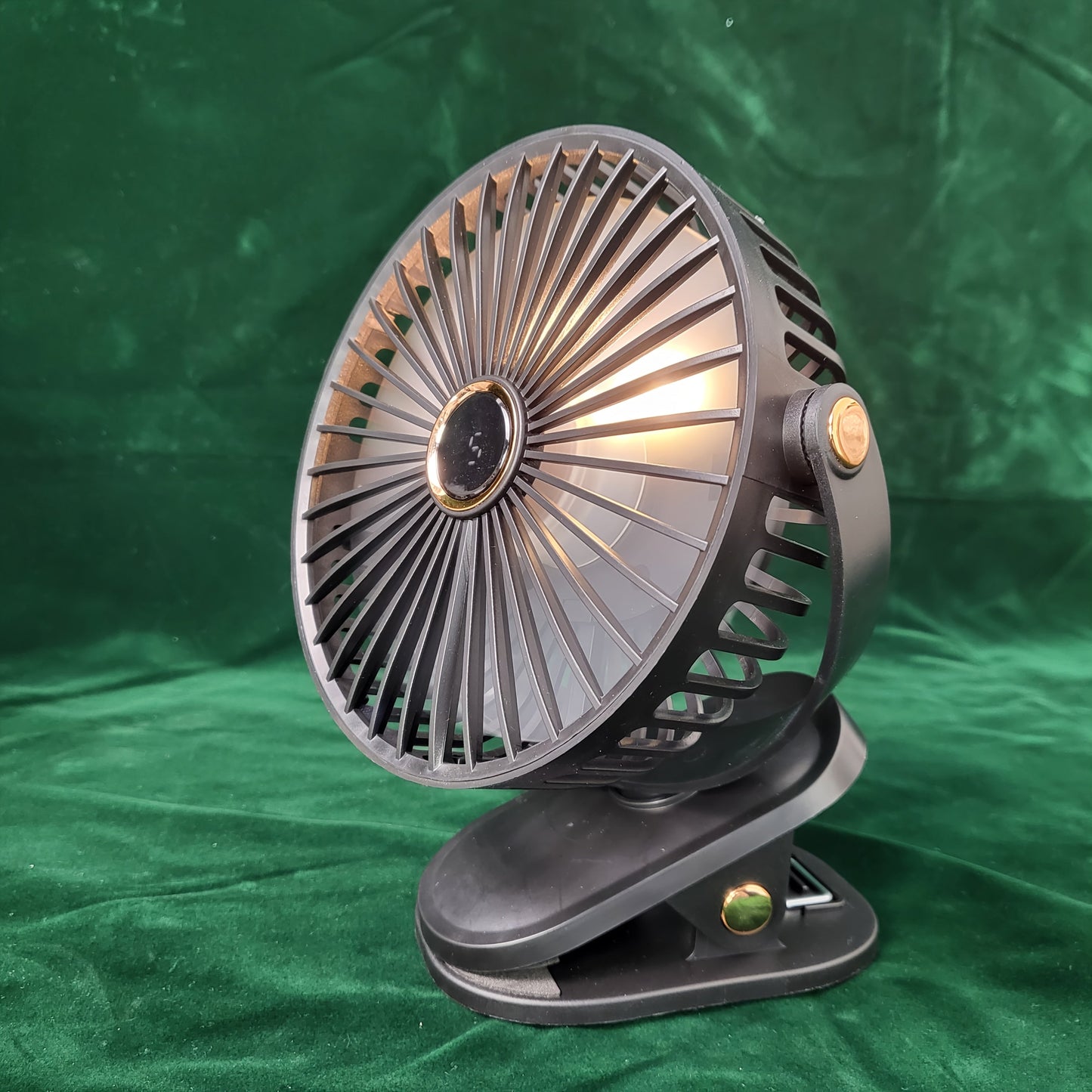 Black Portable Clip-On Fan with 360° Rotatable design is perfect for various settings such as outdoor camping, golf carts, strollers, and home offices. This silent mini table fan offers 5-speed settings and features a built-in lithium battery with