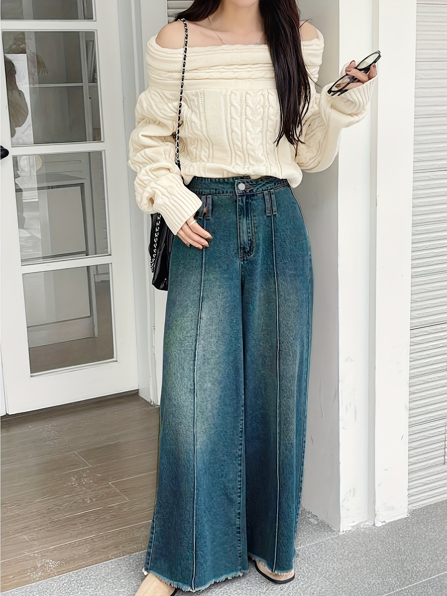 Women's wide-leg denim jeans with elastic waistband, loose fit, mid-rise, and slash pockets in light to dark blue gradient.