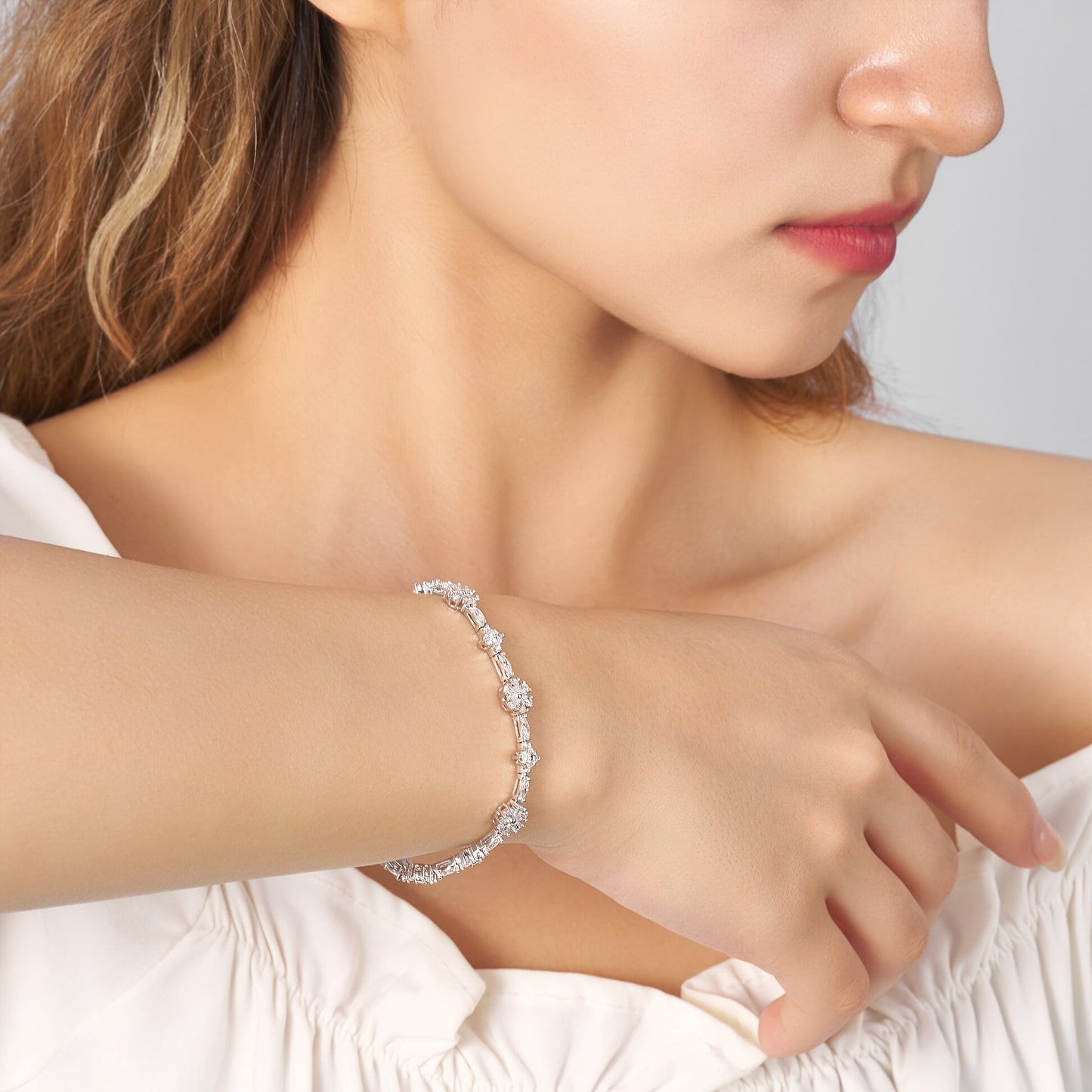 One elegant Onedia bracelet crafted from 925 sterling silver with sparkling synthetic moissanite stones. This stunning piece is adorned with a white golden plating and features the October birthstone. Perfect for gifting, parties, and special occasions