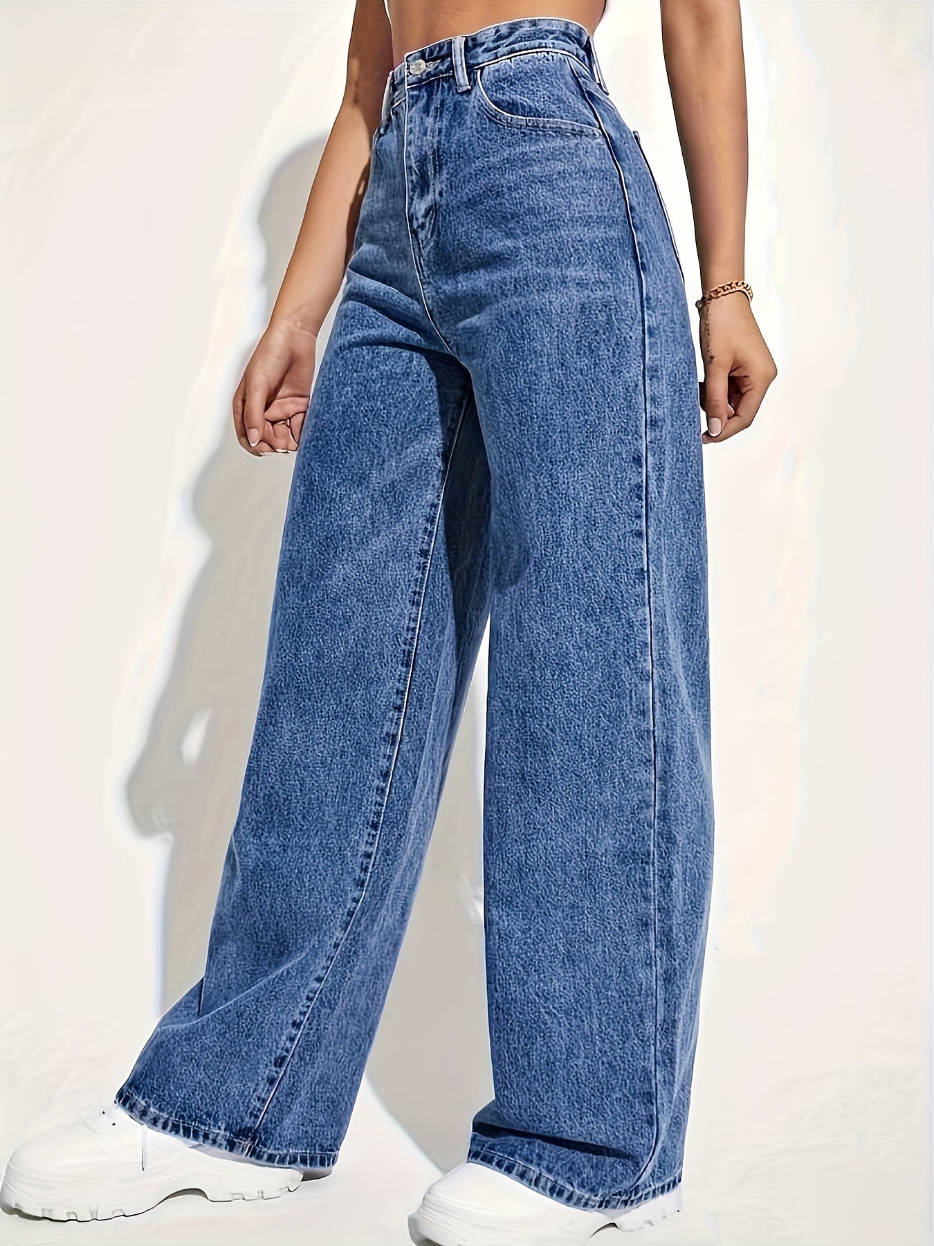 Women's high rise denim jeans with button fly and straight leg.