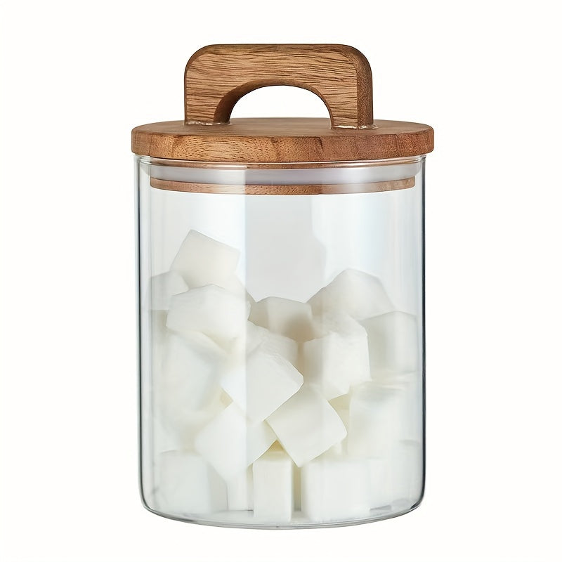 Glass storage jar with a wooden lid and a capacity of 27oz/800mL. This multi-purpose jar is freezer safe and should be hand washed only. Perfect for storing coffee, tea, or food.