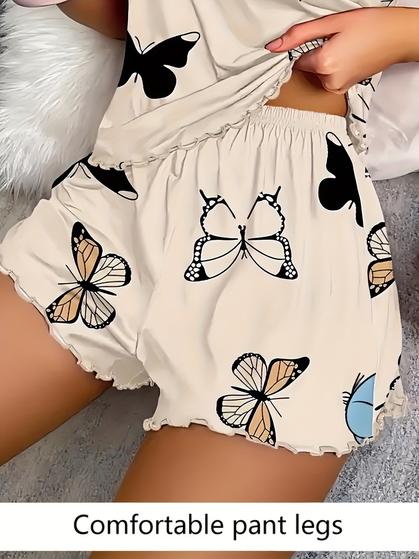 Polyester pajama set for women: Sleeveless cami with butterfly print and elastic shorts with lettuce trim, perfect for summer sleepwear