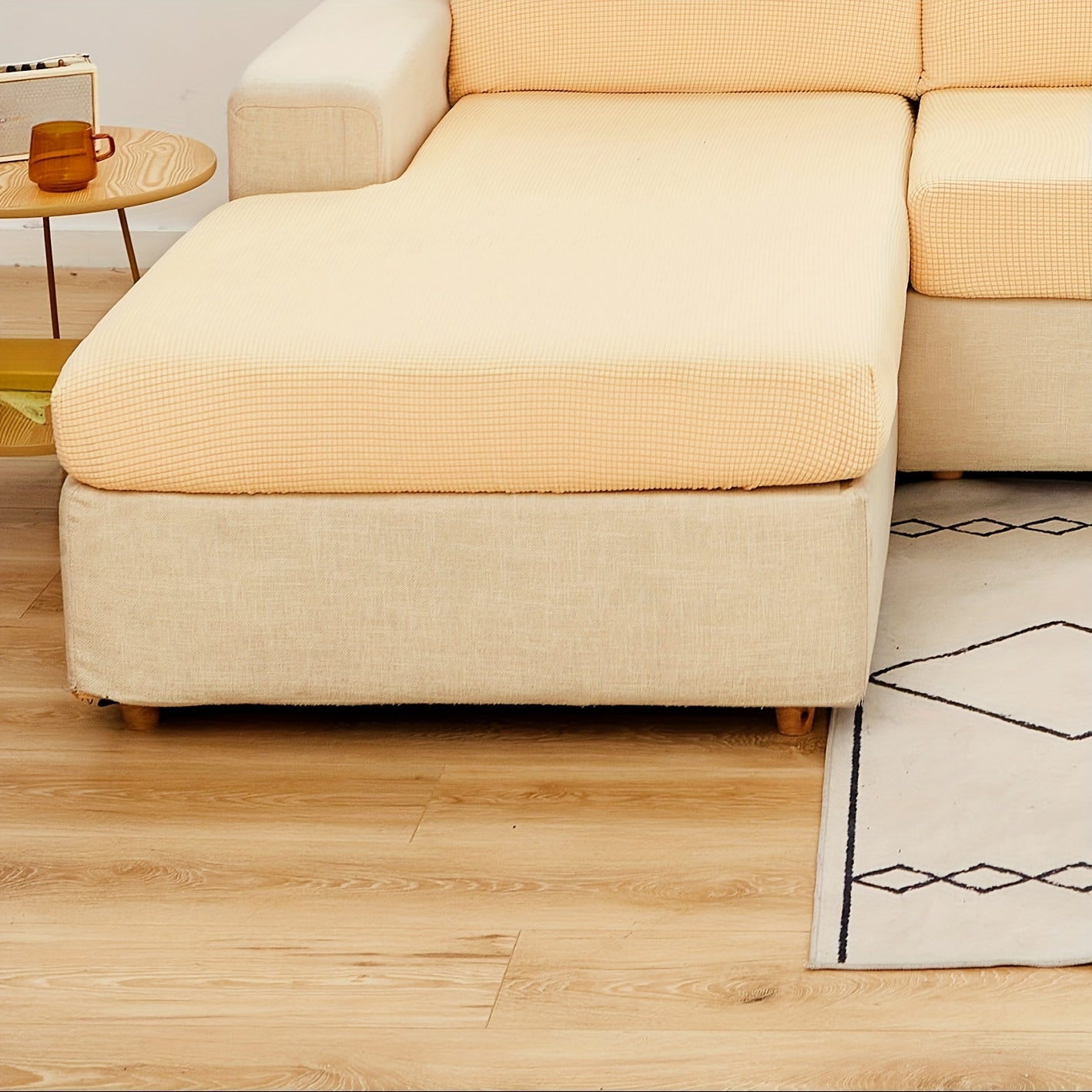 Durable sofa cover protects furniture from spills and stains.