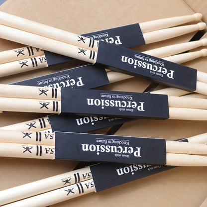 Premium maple drumsticks in 5A and 7A sizes with black logo, suitable for electric drums and practice.