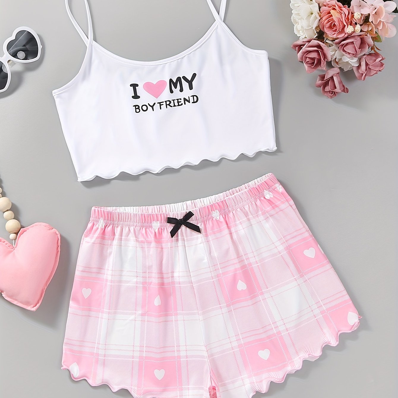 Valentine's Day pajama set for women, featuring heart and slogan print cami top with lettuce trim crew neck and elastic shorts.