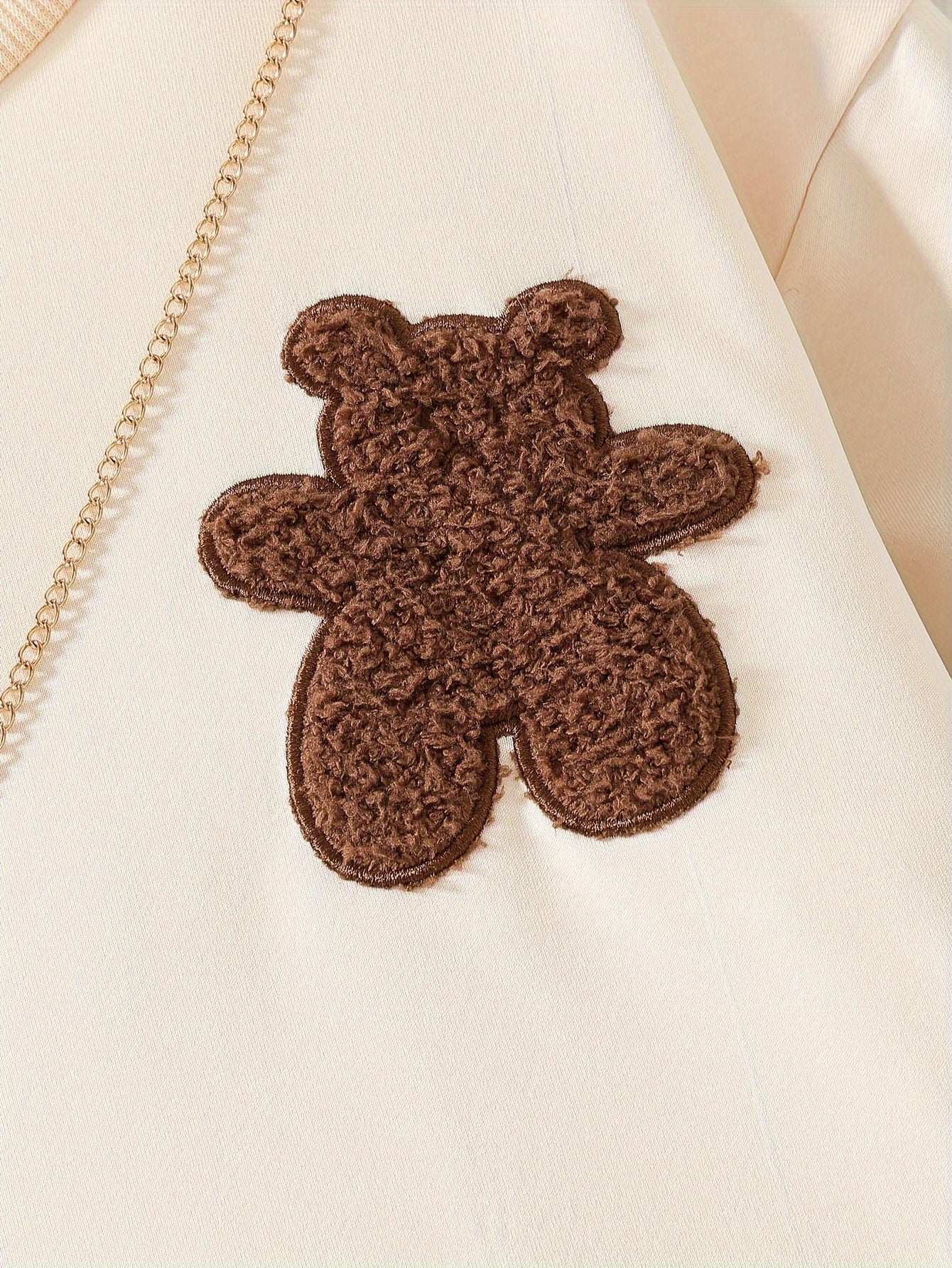 3-piece set with autumn-themed bear embroidery, plaid top, pleated skirt, and bear pendant.