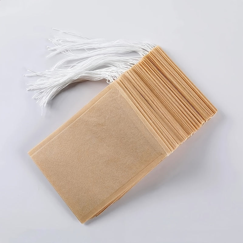 Pack of 100 Natural Biodegradable Drawstring Filter Paper Bags for Coffee, Tea, and Food - Convenient and Eco-Friendly - Disposable Tea Brewer and Empty Tea Bag infused with Pine Leaf Powder and Herbs - Ideal for Brewing and Serving